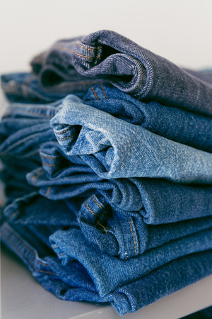 pile of denim jeans