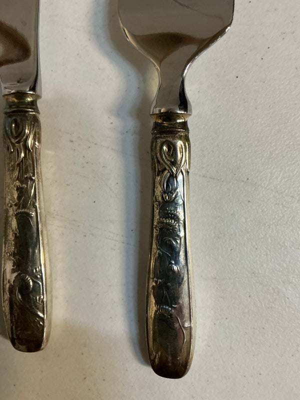 Tiffany and co Sterling Silver are stainless steel cheese knives
