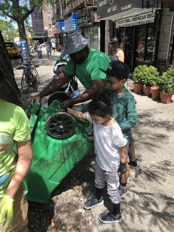 family is dumping compost bin
